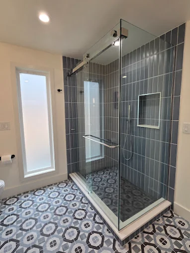 Floral bathroom remodel with a tiled shower area