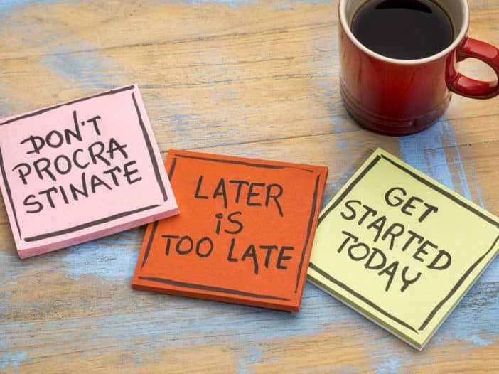 Homeowner looking at a dated room illustrating the cost of procrastinating home repairs
